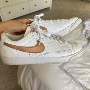White Nikes with rose gold/copper detail
